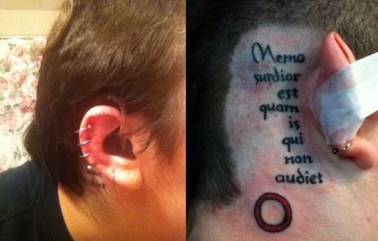 M. Dank proudly wears this tattoo behind his ear and hearing aid. It is translated: 